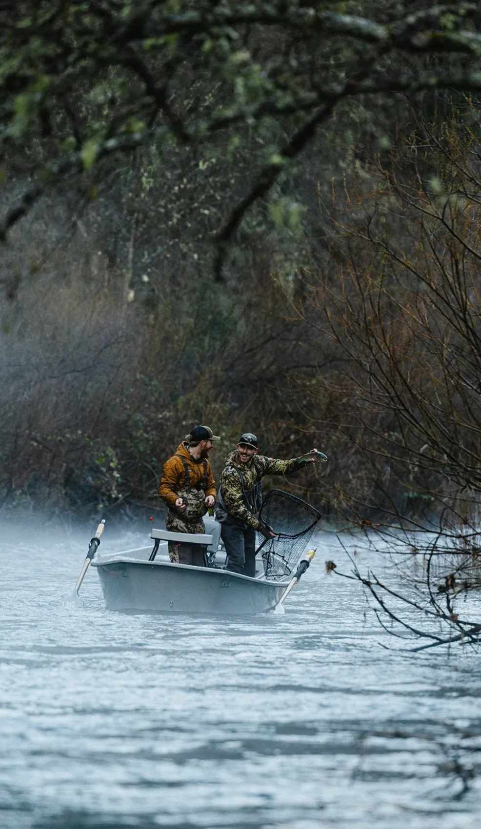 trinity-river-guided-steelhead-fishing Fly fisherman hooked into a steelhead on the Trinity River in Northern California