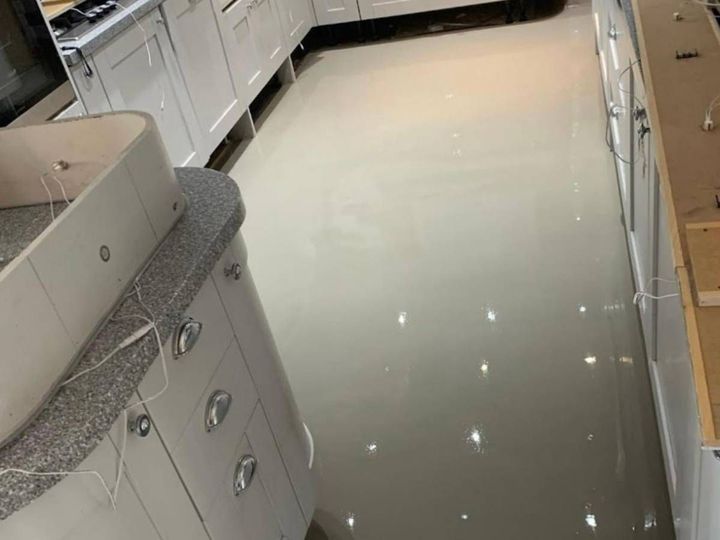 Levelling compound poured over an uneven solid floor