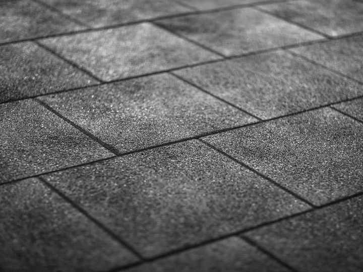 Close-up of black tile-effect rubber flooring