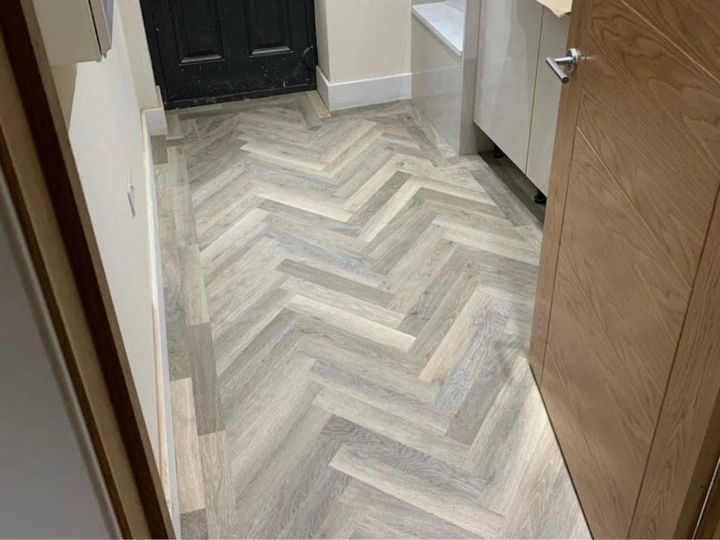 Herringbone luxury vinyl flooring fitted in a utility room