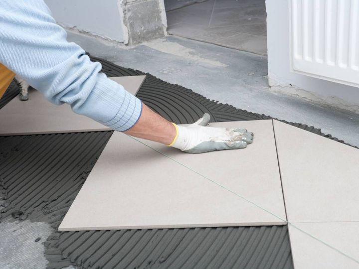 Ceramic floor tiles being installed for a commercial client in Derby