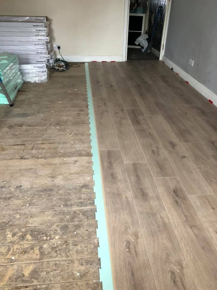 Laminate flooring being installed in a home