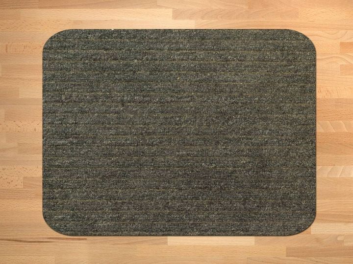 Grey ribbed nylon door mat with rounded corners on a wooden floor