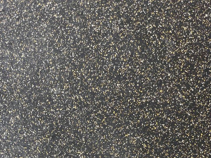 Close-up of grey speckled rubber flooring