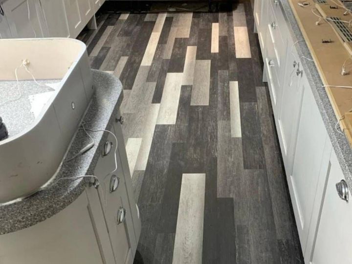 Straight lay luxury vinyl tile flooring fitted in a kitchen