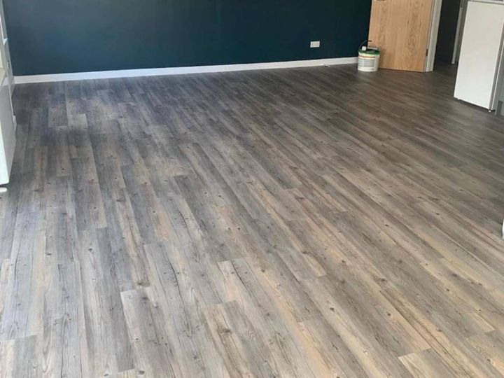 Straight lay luxury vinyl tile flooring fitted in a lounge
