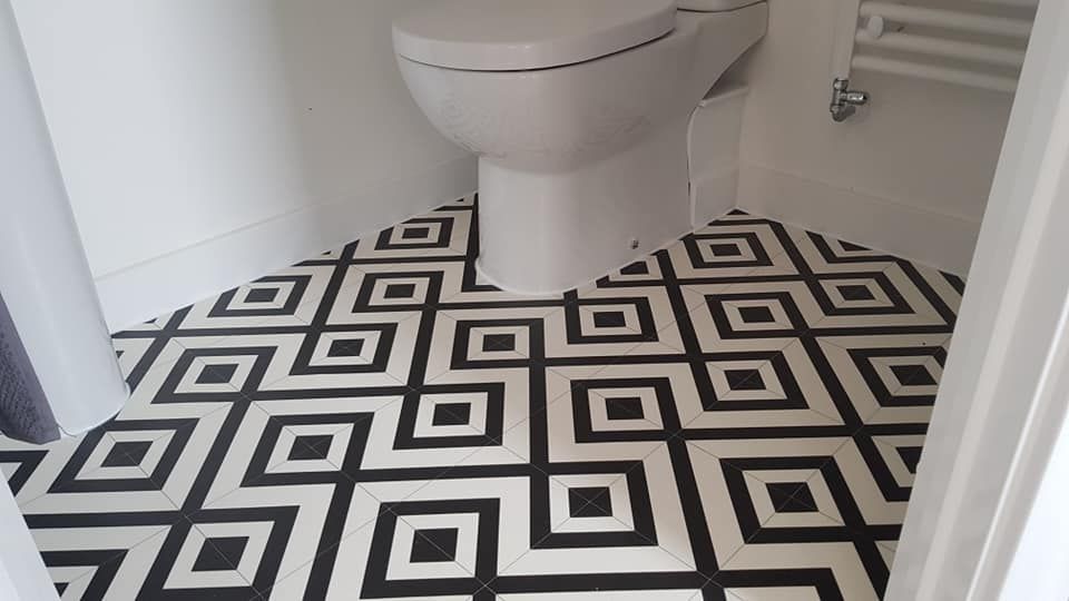 Derbyshire Flooring Specialists fitting vinyl flooring in a bathroom in Derby