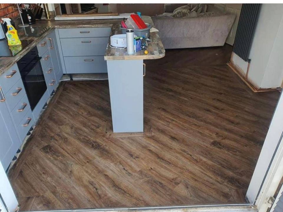 Wood effect LVT flooring fitted in an open plan kitchen and living room in Derbyshire