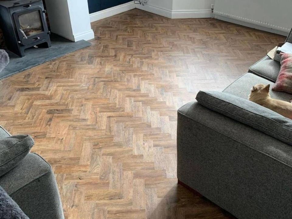Wood effect herringbone flooring fitted in an Amber Valley home
