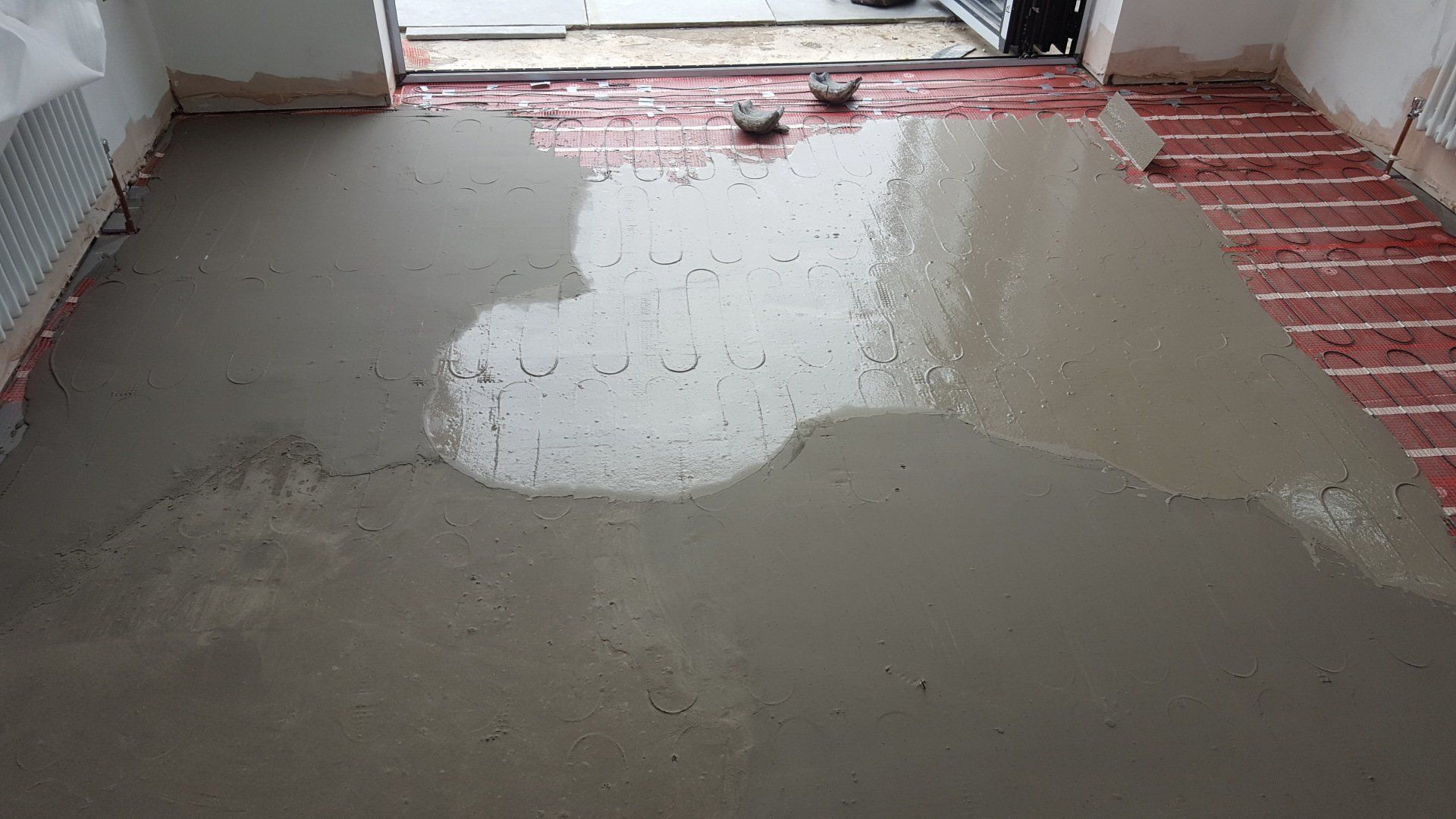 Derbyshire Flooring Specialists screeding over the electric underfloor heating wiring