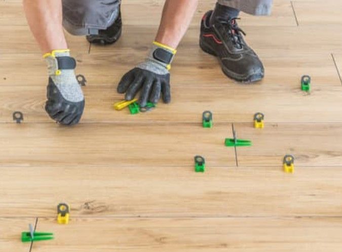 Engineered wood flooring being fitted in a Derby home