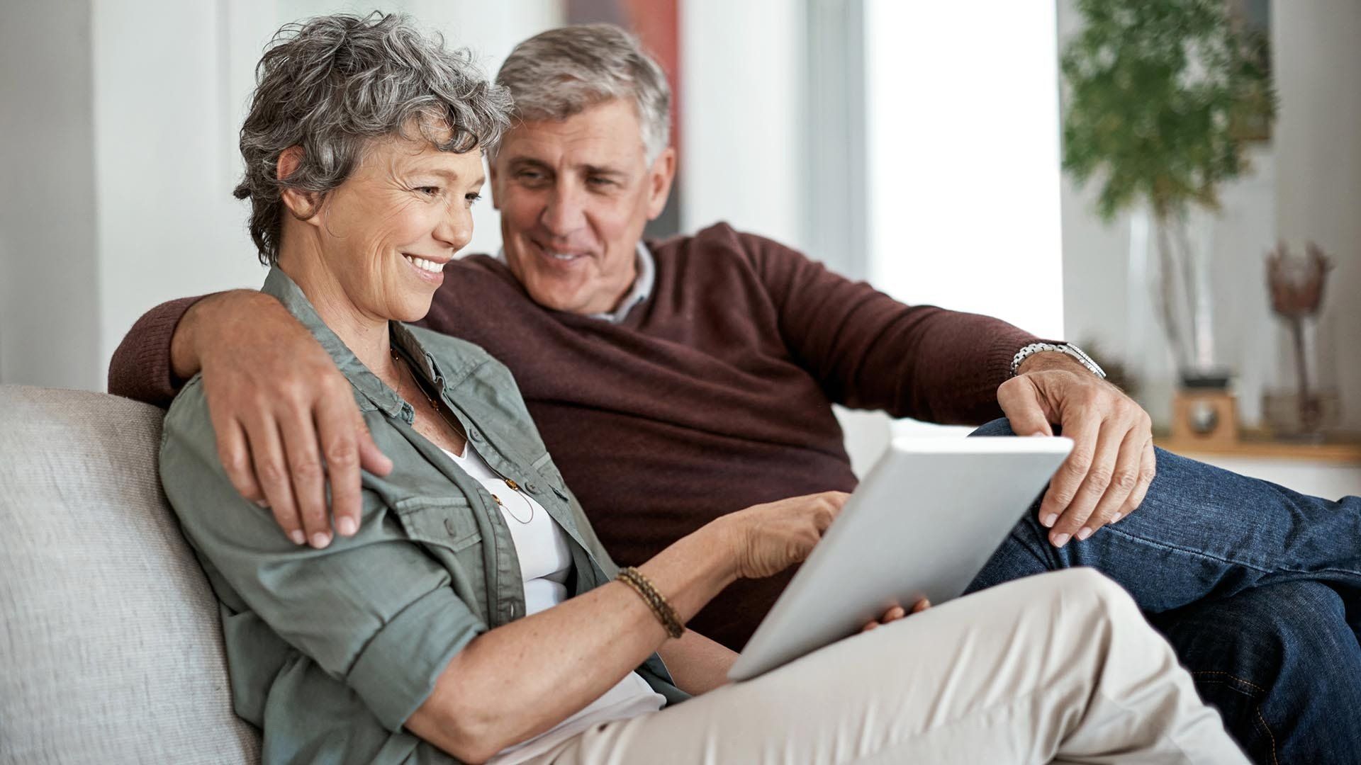 older woman and man sitting down together