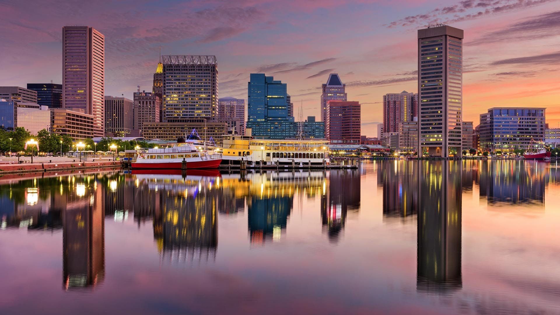 city skyline reflected in a body of water