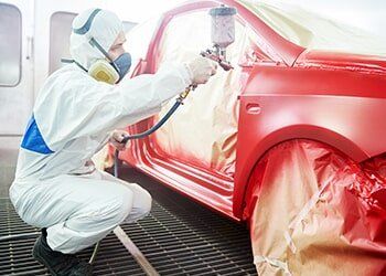 Man Spray Painting Car Red – Automotive paint in Bonville, QLD Man Spray Painting Car Red – Automotive paint in Bonville, QLD