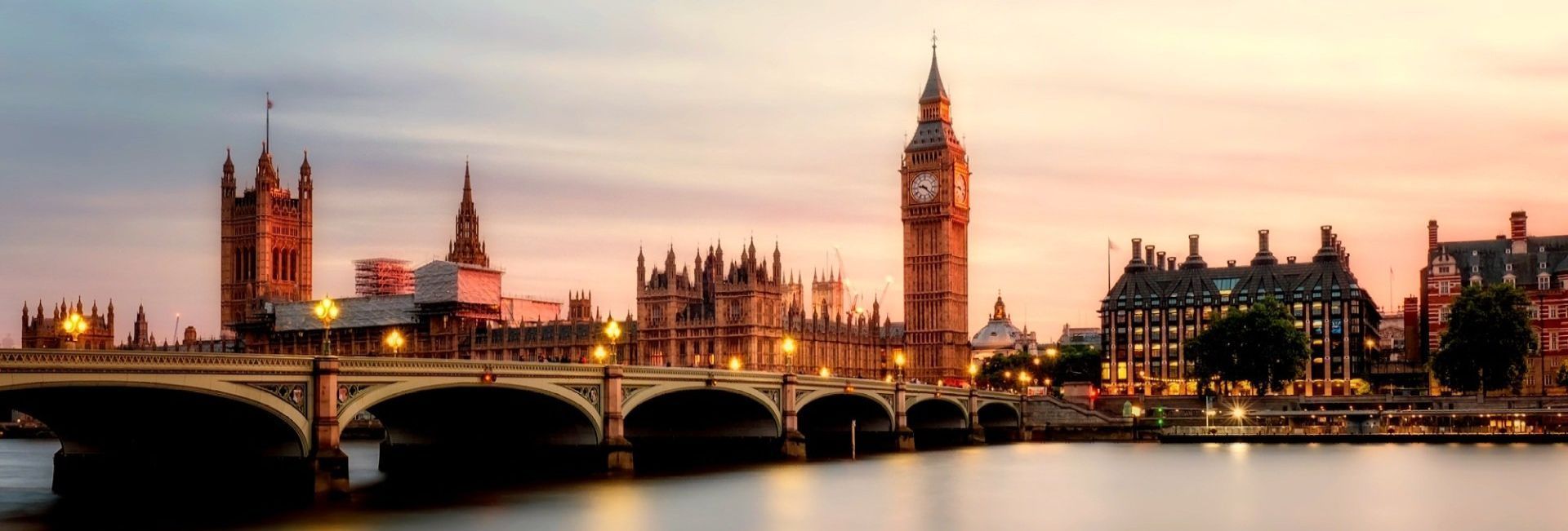 Sunset over London’s Houses of Parliament and Big Ben, with Westminster Bridge in the foreground