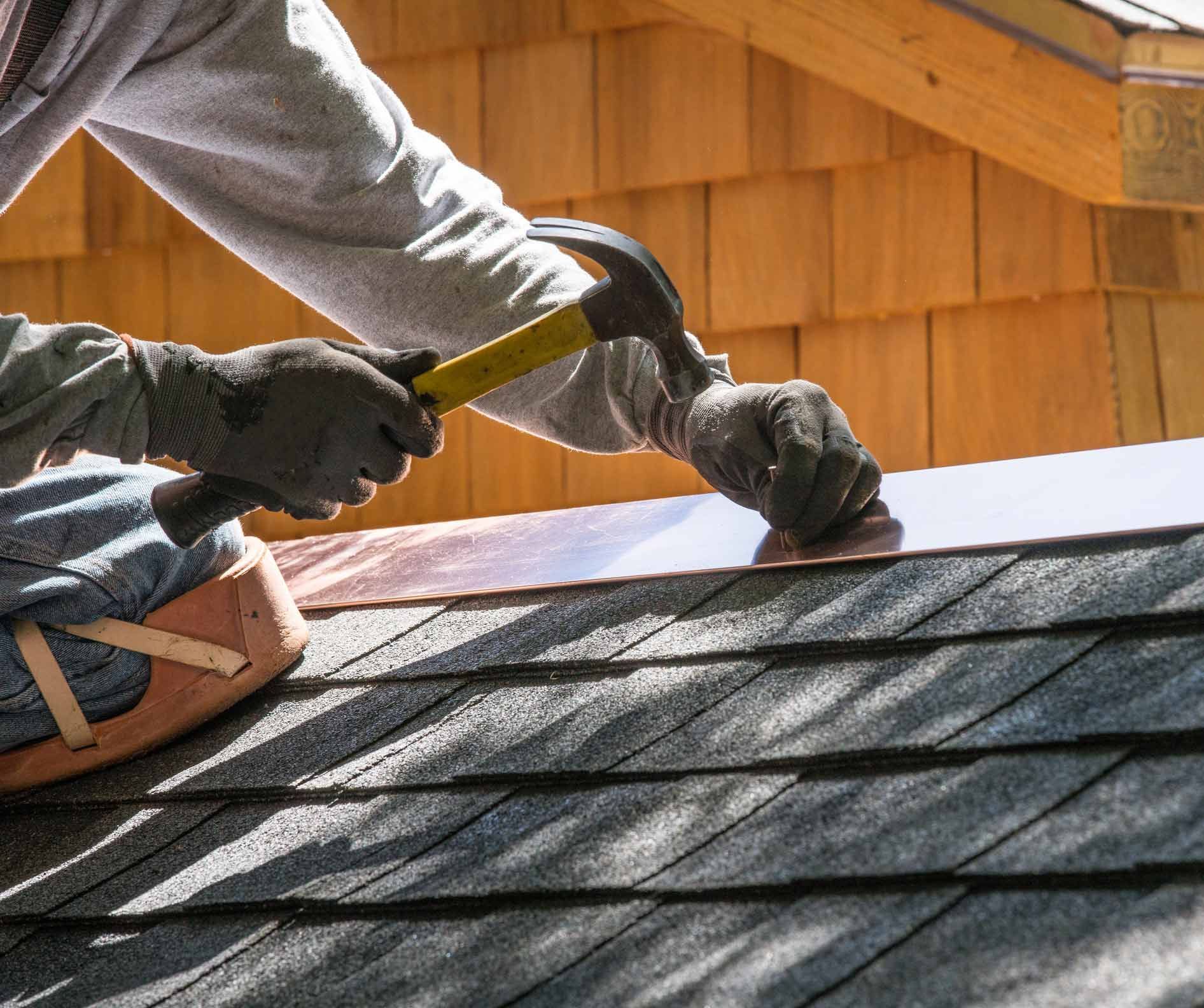 Installing New Roof With Hammer And Copper Edge Flashing — Moundville, AL — JD Johnson Roofing Installing New Roof With Hammer And Copper Edge Flashing — Moundville, AL — JD Johnson Roofing