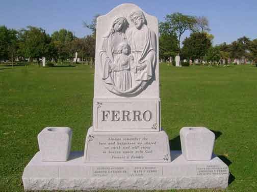 A grey stone family gravestone inscribed 