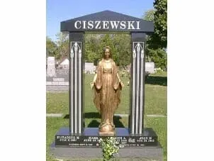 A black granite gravestone with the name CISZEWSKI, featuring a central statue of a figure under a roofed archway.