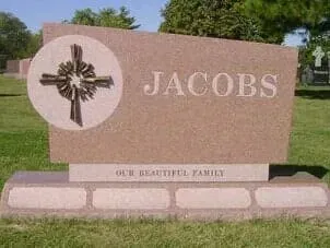 A granite family headstone labeled 