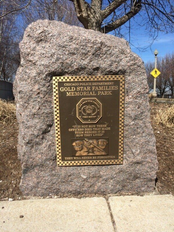 Granite memorial with a brass plaque for Chicago Police Department Gold Star Families.