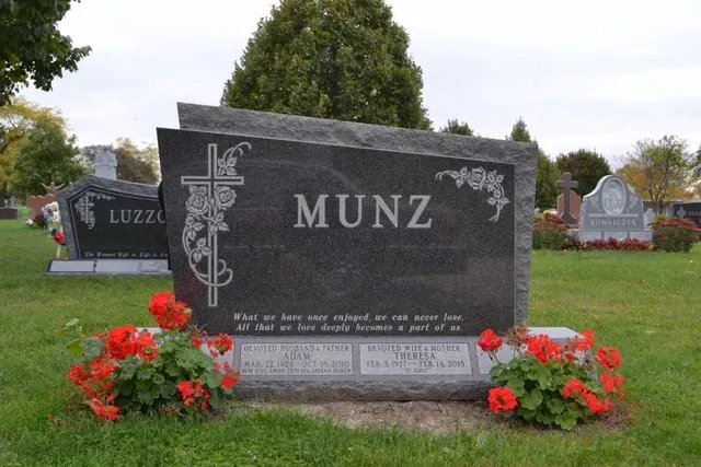 A black granite headstone with the name 
