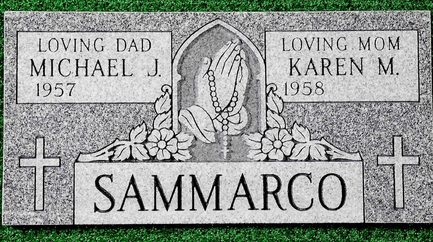 A gray granite double grave marker inscribed with
