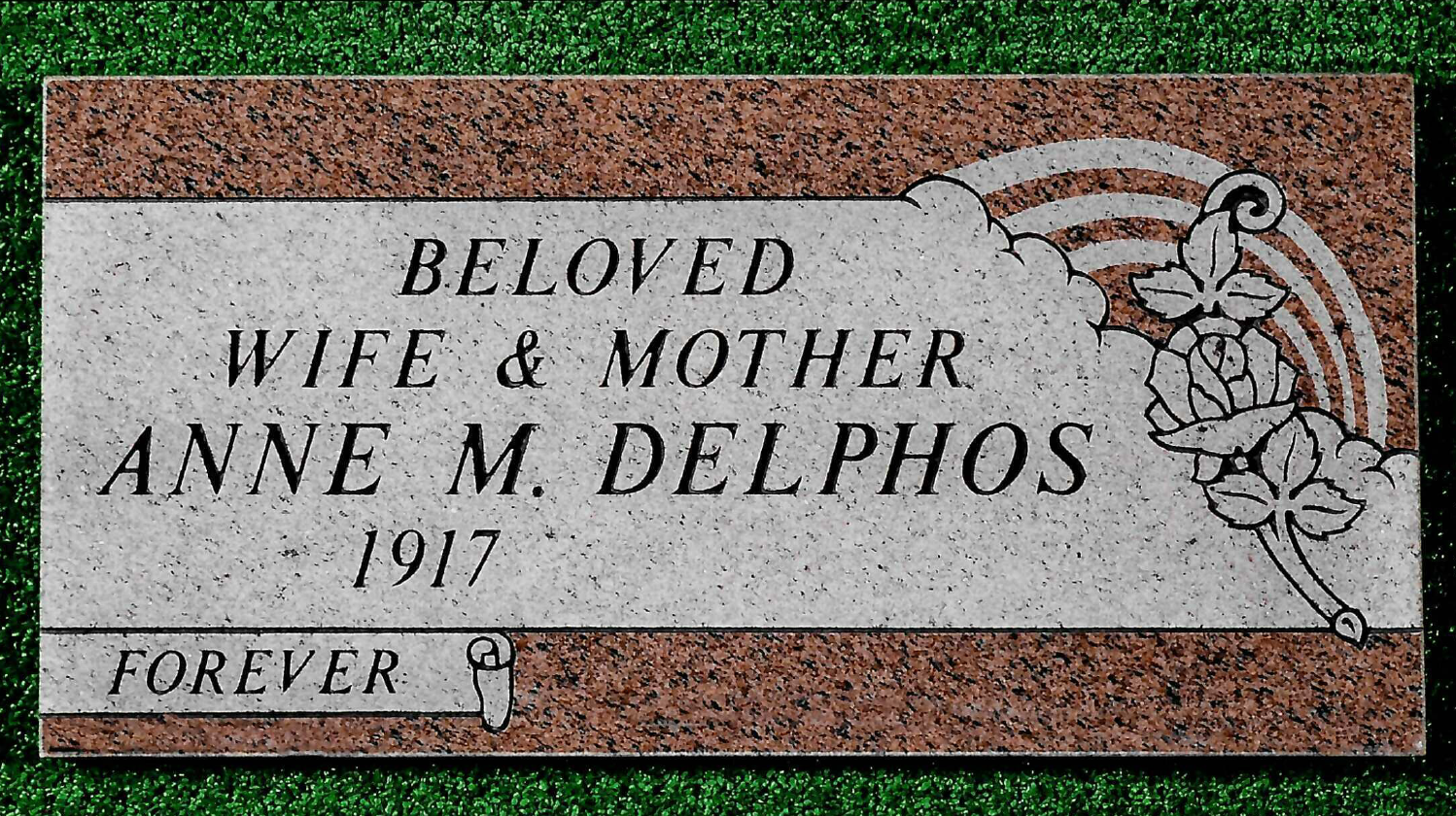 A granite memorial marker reading: