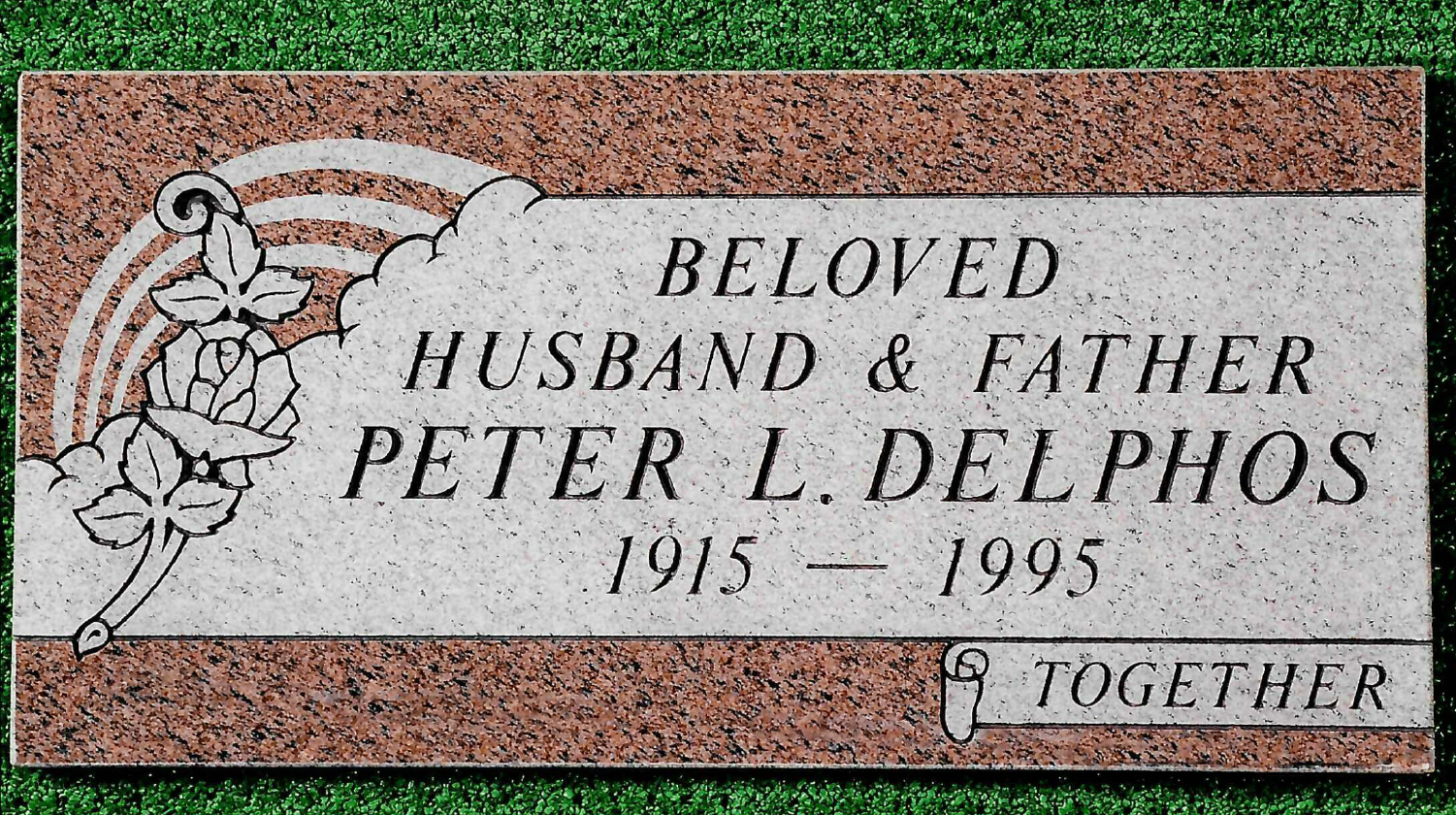 A rectangular pink granite grave marker for Peter L. Delphos (1915–1995) with an engraved rose and the word