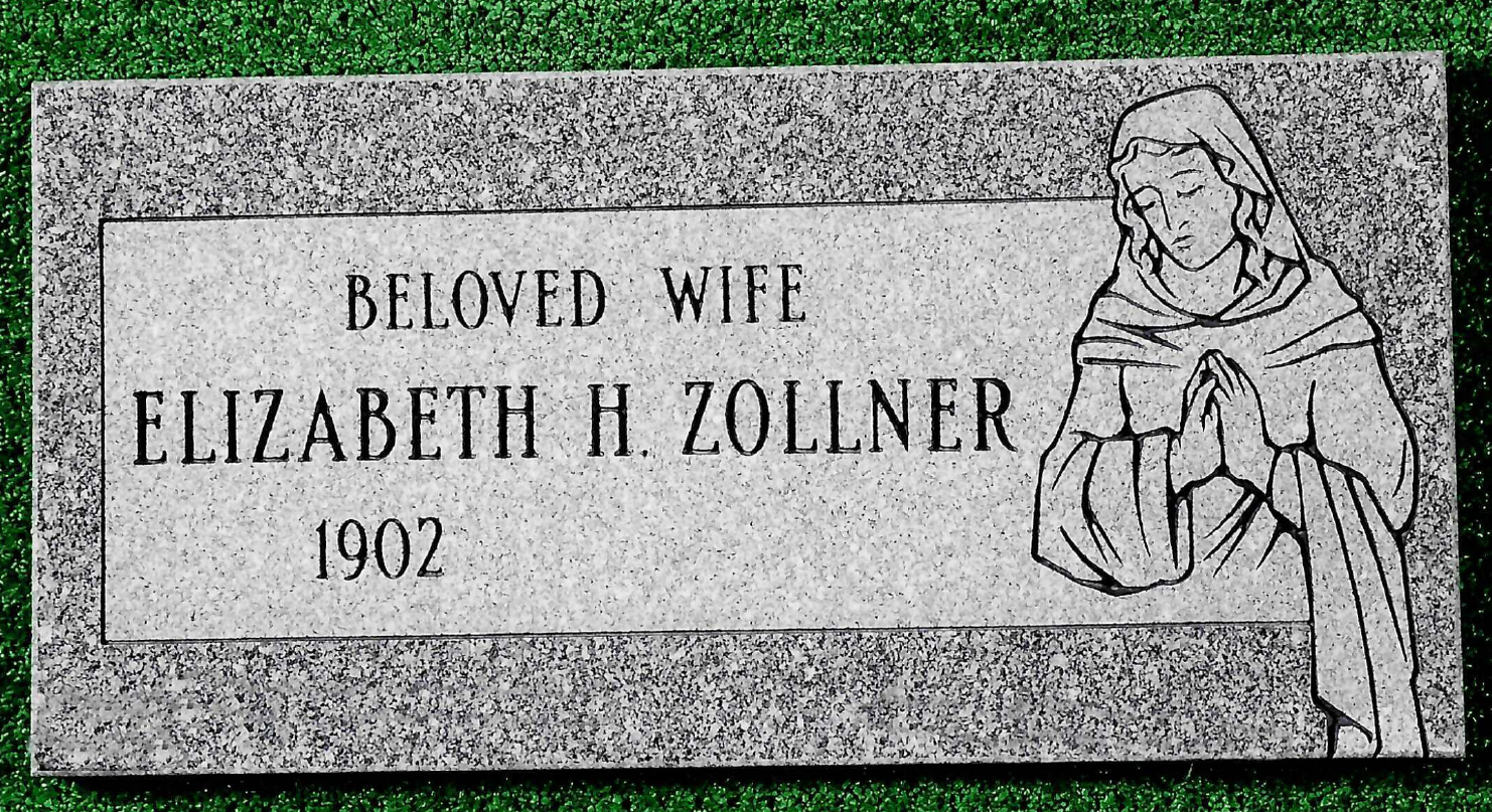 A rectangular gray granite grave marker engraved