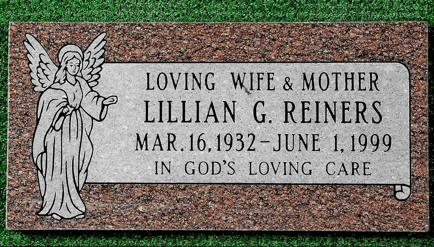 A red granite grave marker with an engraved angel and the text