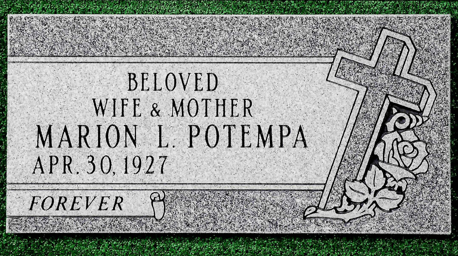 A granite grave marker for Marion L. Potempa, born April 30, 1927, engraved with a cross, roses, and