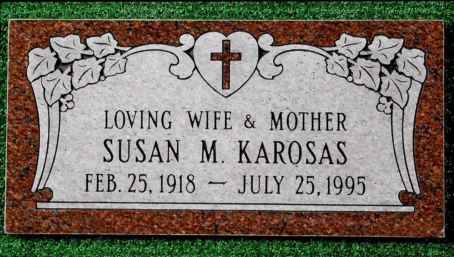 A rectangular granite grave marker for Susan M. Karosas, dated Feb. 25, 1918–July 25, 1995, featuring a central cross heart.