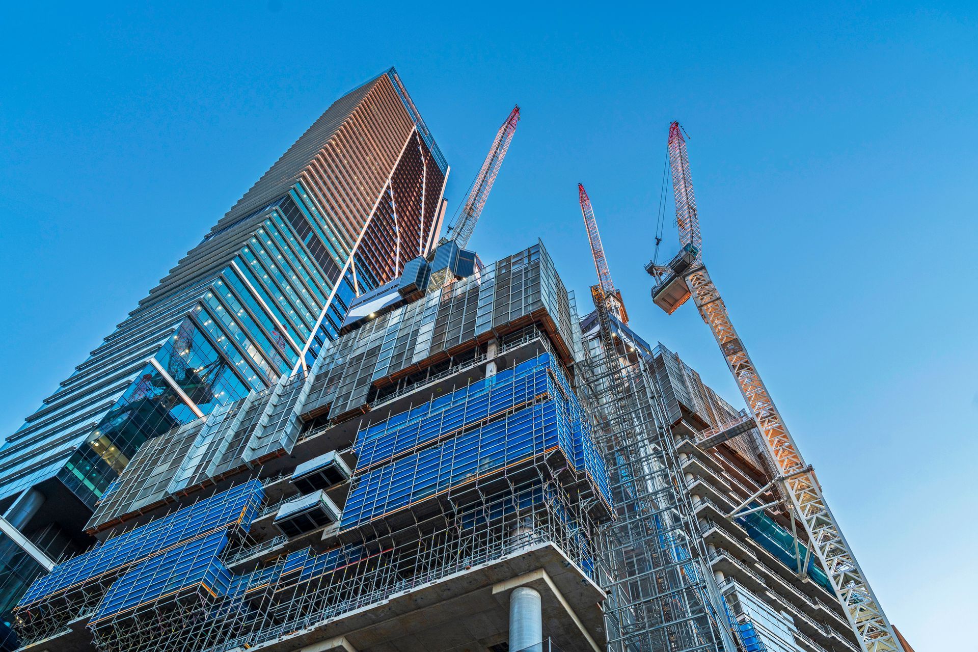 Luxury apartment construction, office buildings, blue sky