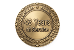 Gold circular service award medal reading “43 Years of Service” with laurel wreath border