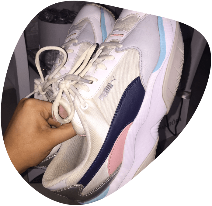 shoes held in hand