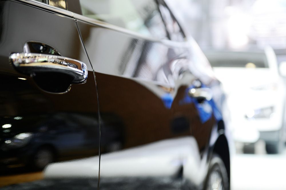 A Close Up Of The Door Handle Of A Black Car — Taminda Smash Repairs In Taminda, NSW