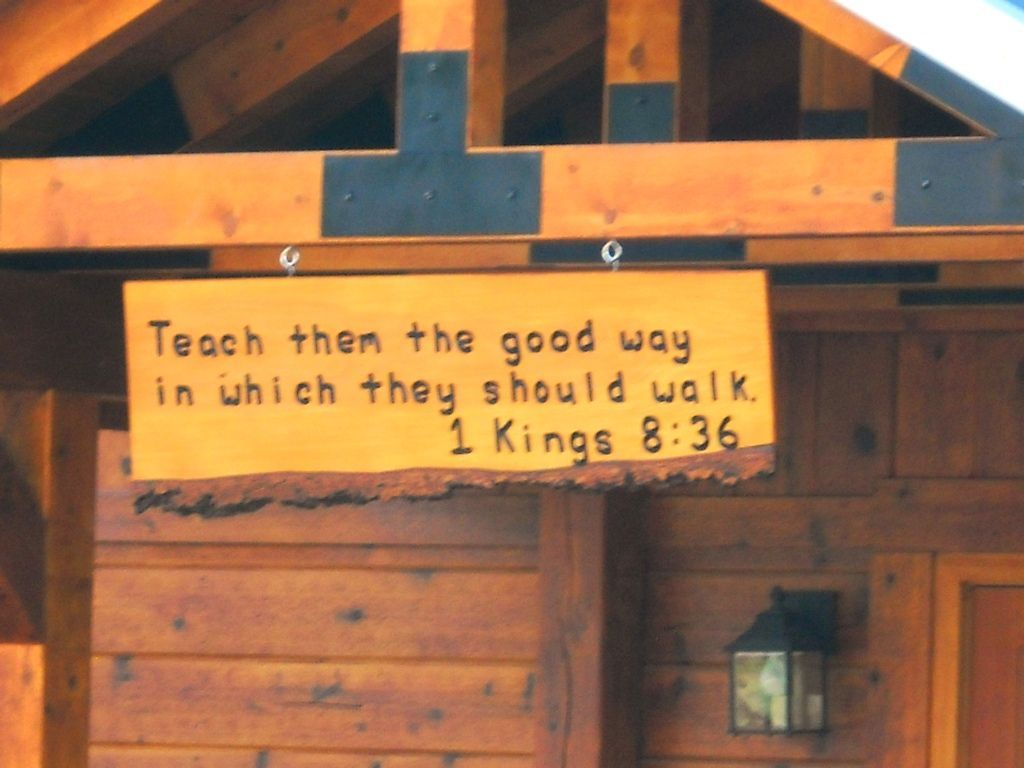 Wooden sign on cabin: 