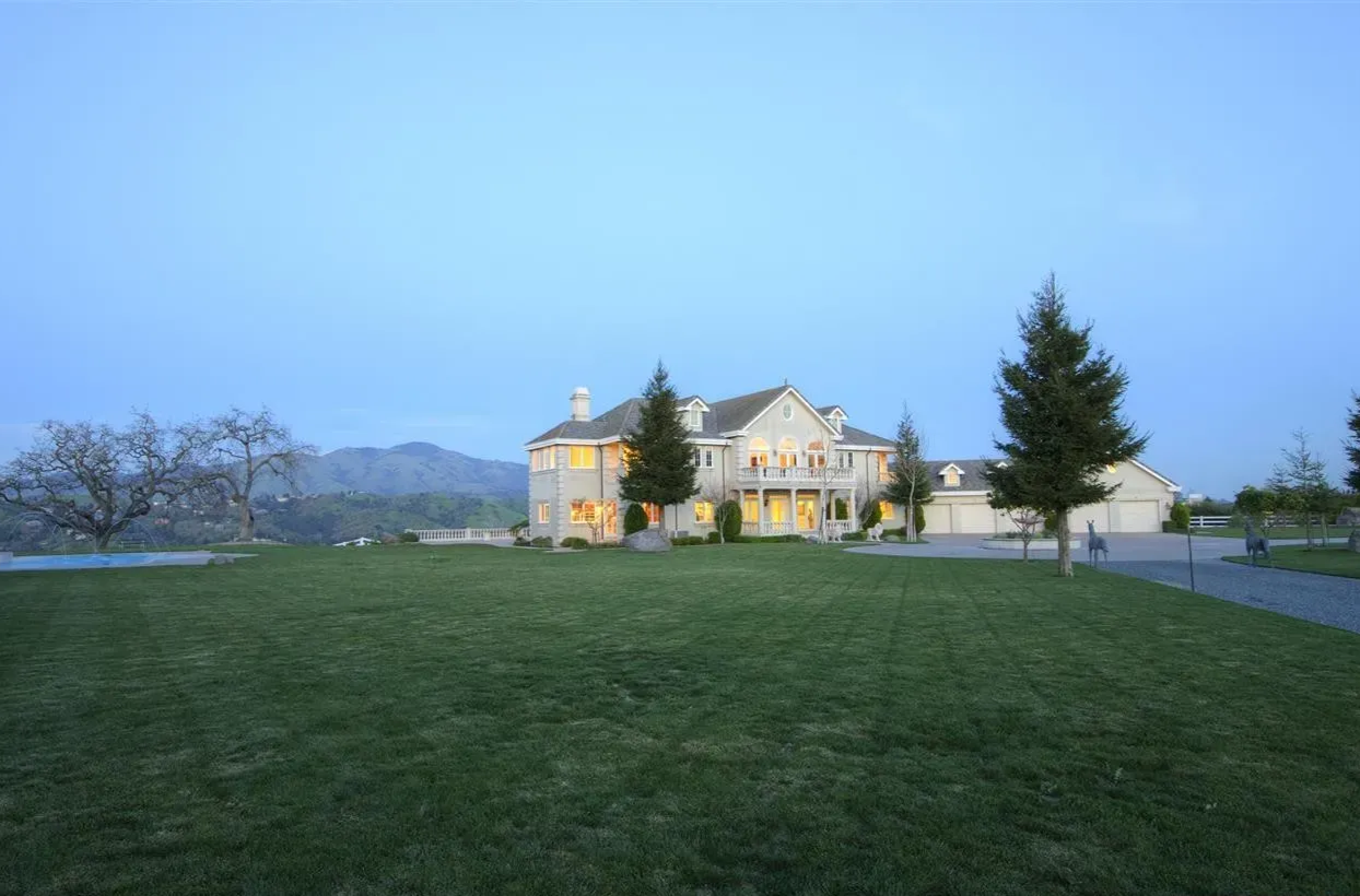 Original luxury home before remodeling with a traditional exterior