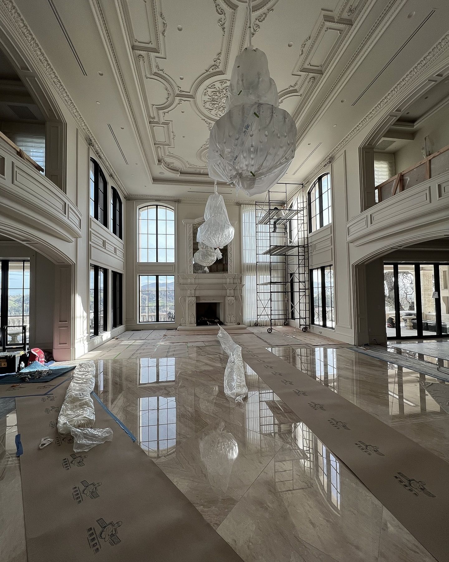 Luxury home architecture with dual height ceilings, millworker and marble flooring by Fratantoni