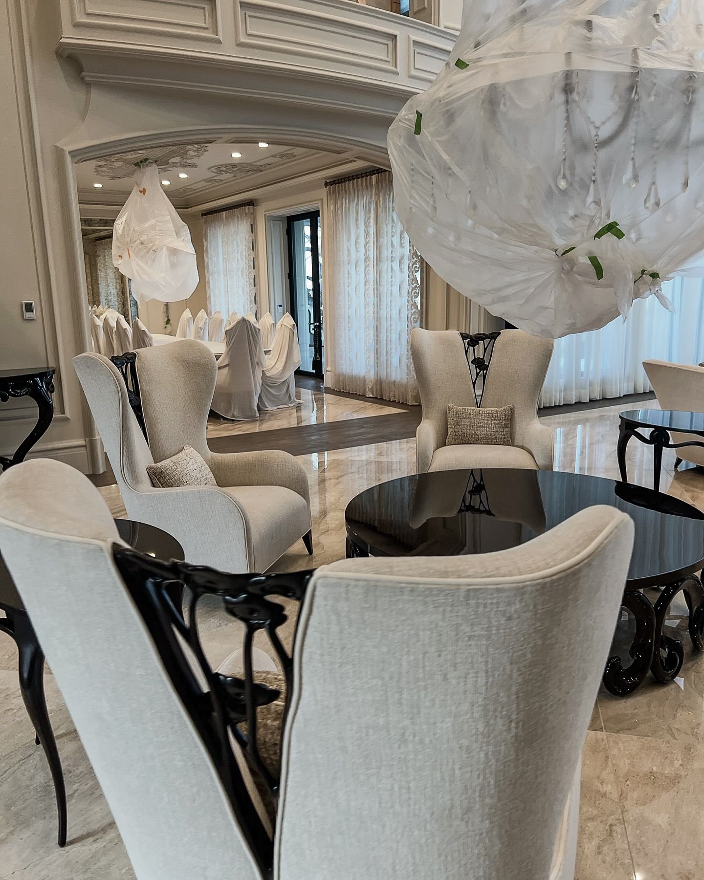 Elegant cream seating area with ornate white decor in a bright luxury interior
