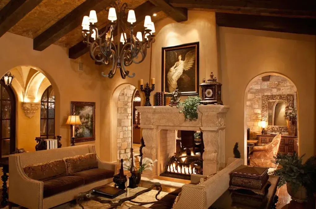 Luxury penthouse remodel with restored wood beams and stone fireplace