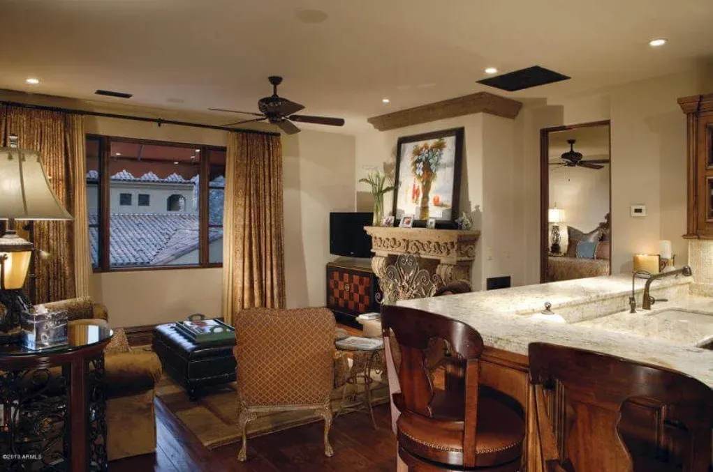Luxury home interior featuring a bedroom suite with custom cabinetry
