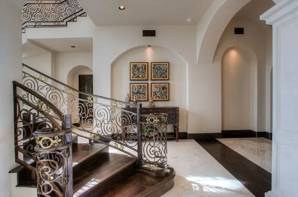 Luxury interior with axial alignment of staircases and design elements