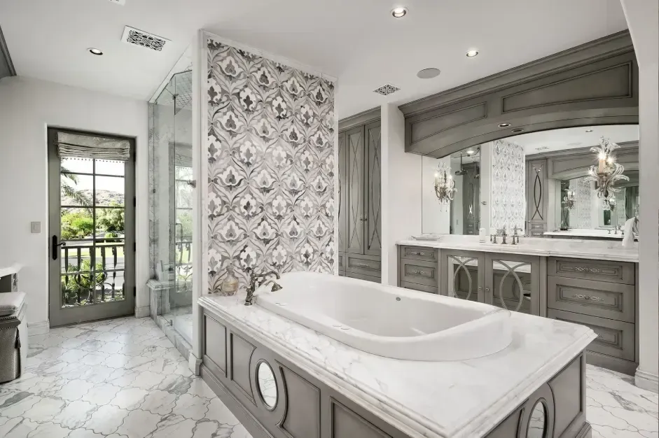 Luxurious master bathroom with freestanding tub and elegant finishes