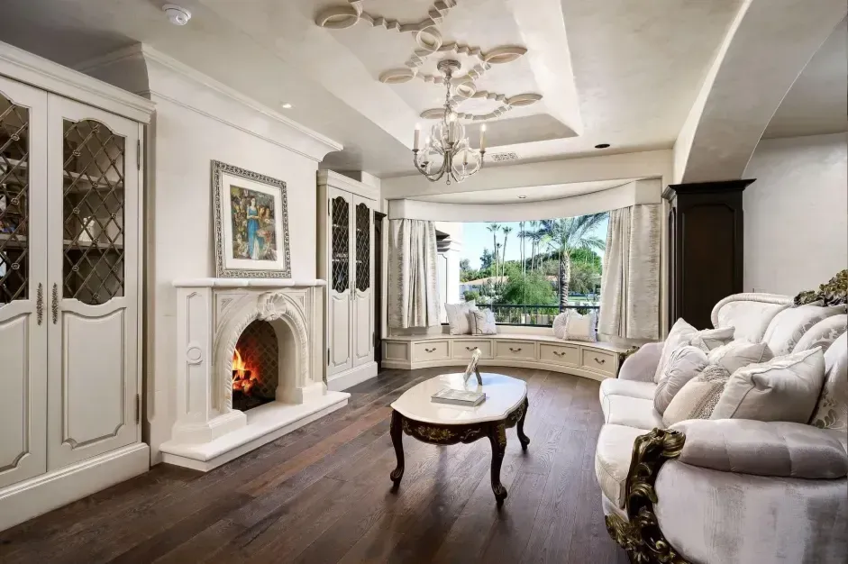 Master bedroom sitting room with fireplace and balcony