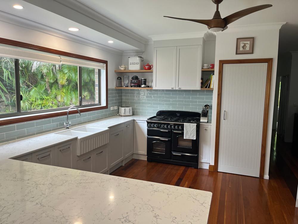 Renovated Kitchen With White Cabinets
