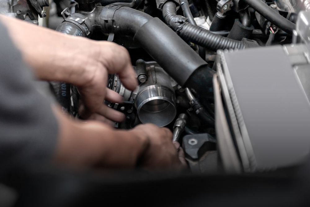 A Man is Working on the Engine of a Car — Dynamic Performance Systems in Adelaide, SA