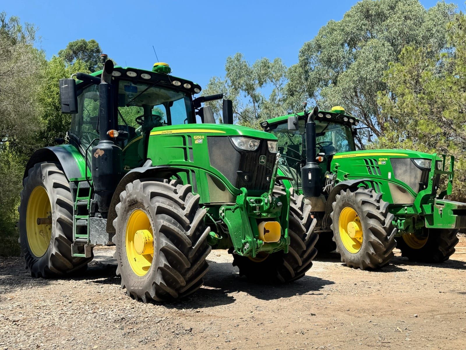 A Silver Truck is Parked in a Dirt Lot Next to a Tree — Dynamic Performance Systems In Kelso, NSW