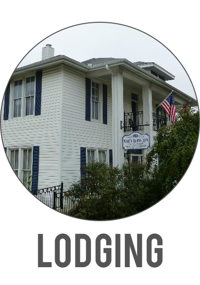 White house with an American flag and the word “LODGING” below it.