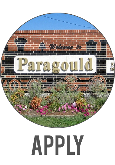 Paragould city sign with flowers and the word “APPLY” below